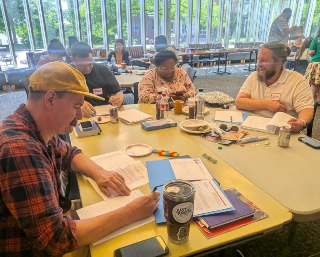 Union members sitting around a table talking